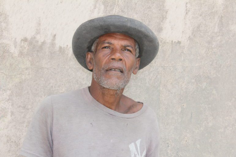 Root crop farmer, Grafton "Journey" Caesar, defied the evacuation order to take care of his animals. 