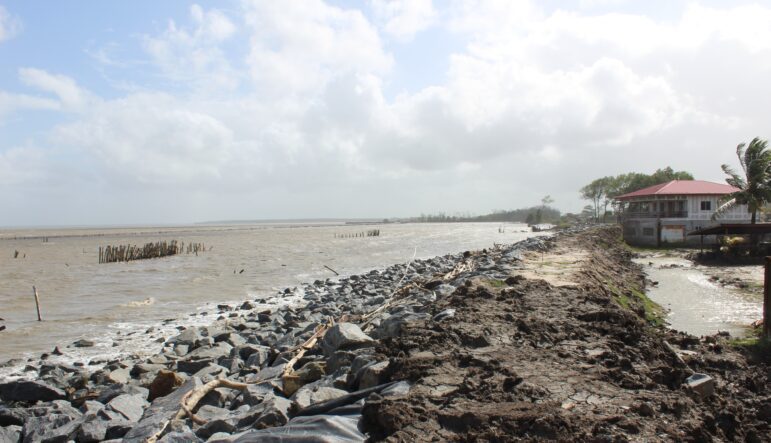 Part of the new sea dike under construction, as seen from Ganpat’s backyard 